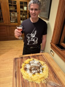 Dr. Carbone prepares to serve polenta with ragu