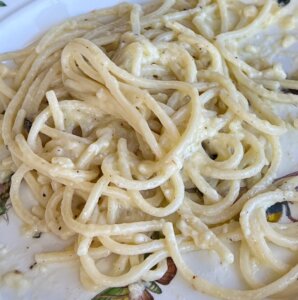 Detail of cacio e pepe with spaghetti